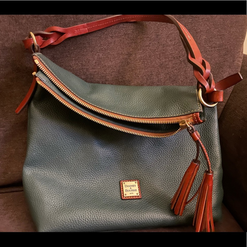 Pine green medium size Dooney shoulder bag.